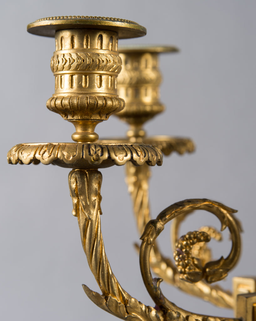 Pair of French ormolu candelabras with cherub on top