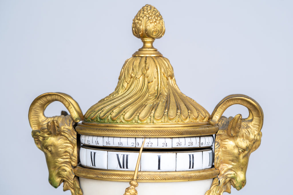 A RARE FRENCH LOUIS XVI STYLE ORMOLU MOUNTED ANNULAR CLOCK GARNITURE BY DUFAUD
