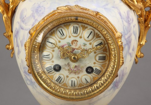 A FRENCH SEVRES STYLE WHITE PORCELAIN & GILT BRONZE CLOCK GARNITURE, 19TH CENTURY