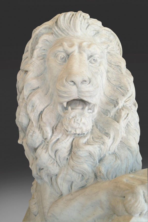 AN IMPRESSIVE PAIR OF ENGLISH CARVED MARBLE LIONS AFTER JOSEF GOTT